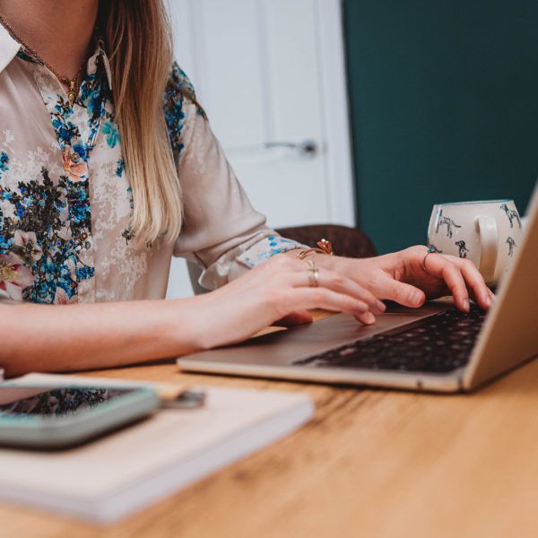 Website copywriting - conversion copywriter - Tasmin at Fika Digital - typing on macbook keyboard